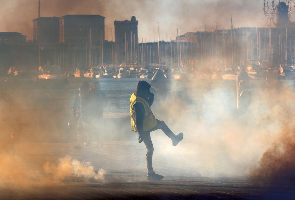 A protestor clashes with French Gendarmes in Paris.