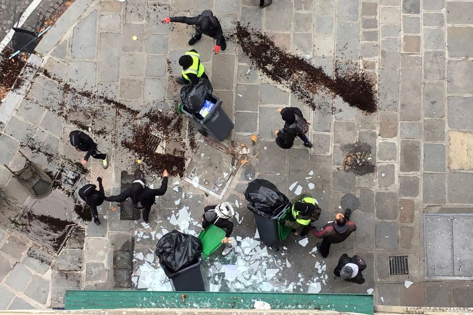 Demonstrators vandalise a branch of American coffee chain Starbucks in Paris, France.