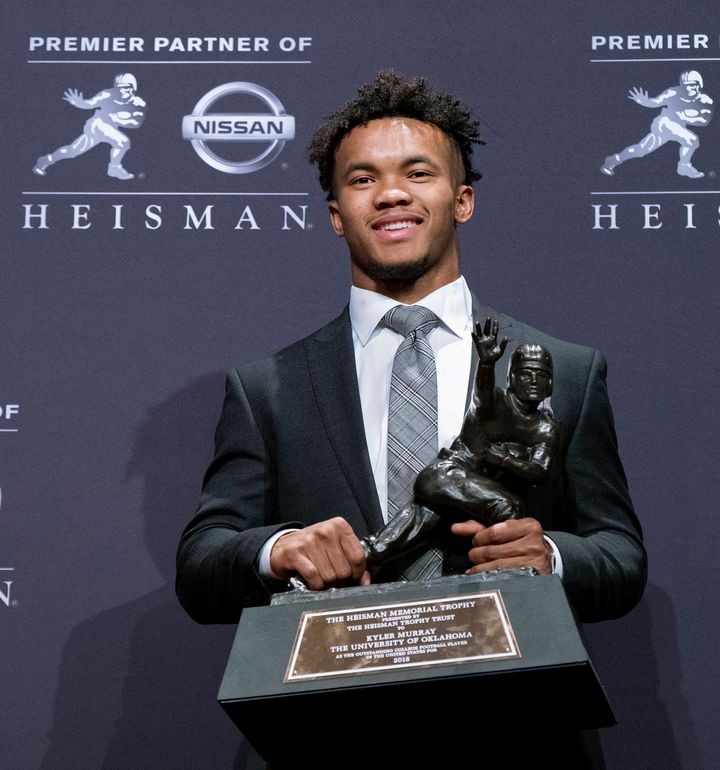 Oklahoma quarterback Kyler Murray poses with the Heisman Trophy after winning the award Saturday in New York.