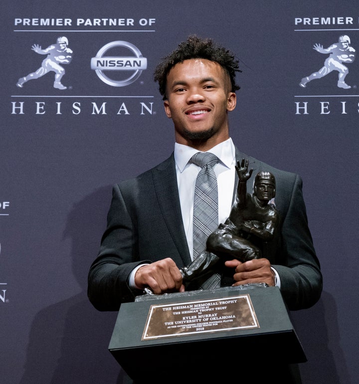 Oklahoma quarterback Kyler Murray poses with the Heisman Trophy after winning the award Saturday in New York.