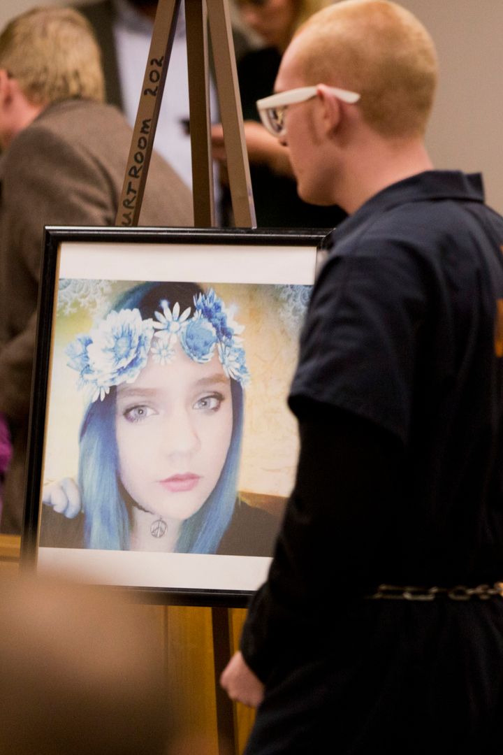 Tyerell Joe Przybycien walks by a photo of Jchandra Brown in the 4th District Court during his sentencing on Dec. 7, 2018, in Provo, Utah. 
