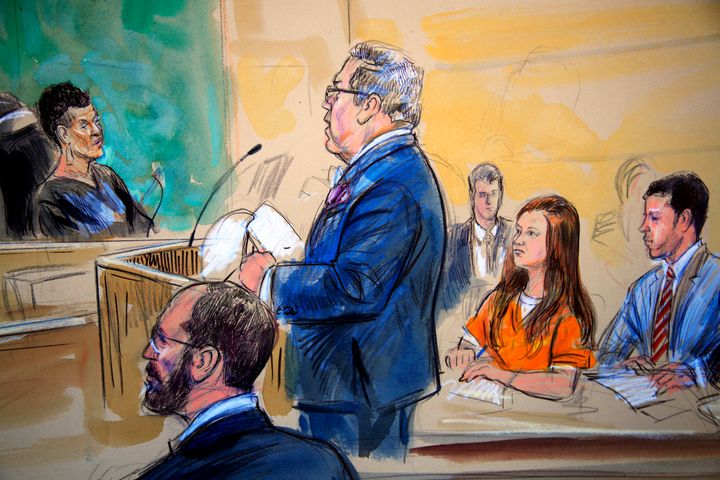 This courtroom sketch depicts Maria Butina, in orange suit, during a hearing in federal court in Washington, D.C., in July. 