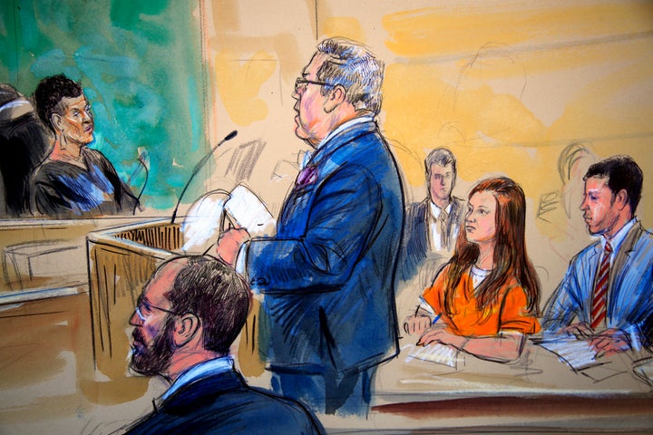 This courtroom sketch depicts Maria Butina, in orange suit, during a hearing in federal court in Washington, D.C., in July.&n
