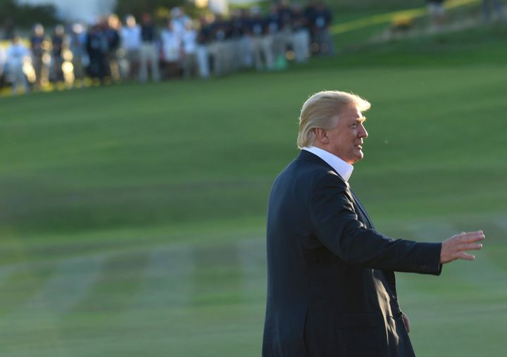 President Donald Trump walks on the course before he presented the United States team with the Presidents Cup at the Jersey City Golf Club in New Jersey. 