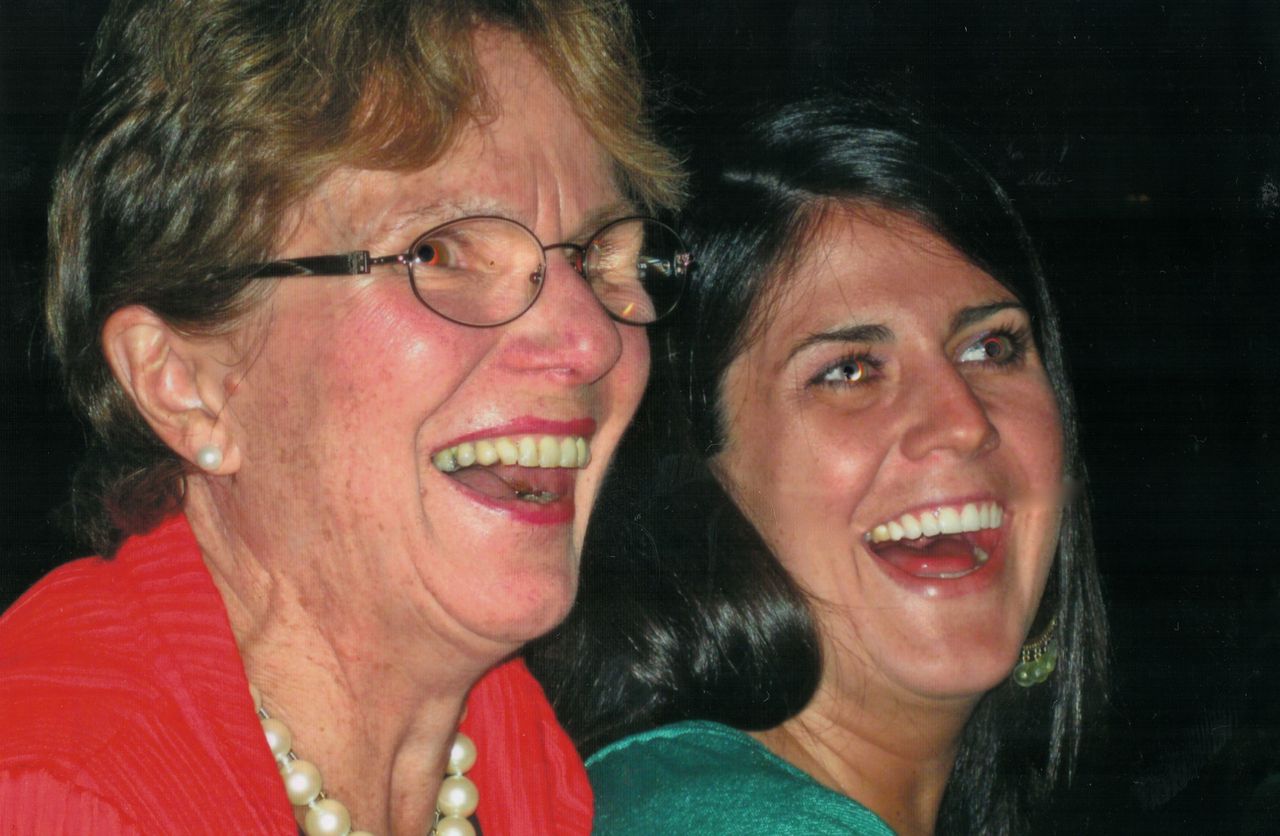Katie C. Reilly and her mom sharing a laugh at her birthday dinner in the summer of 2008.