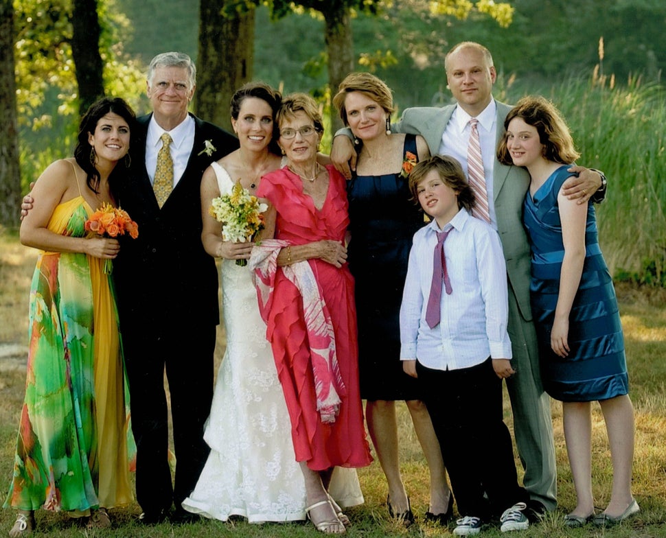 My family at my sister's wedding in June 2010. The fact that my mom is in the middle of the family is not surprising, given t