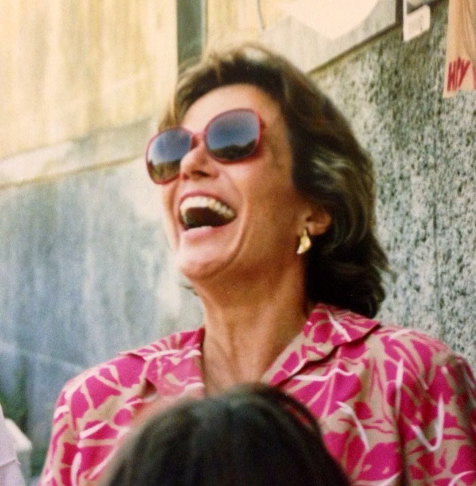 Reilly's mom doing her famous head-thrown-back laugh on a family vacation in the late 1980s.