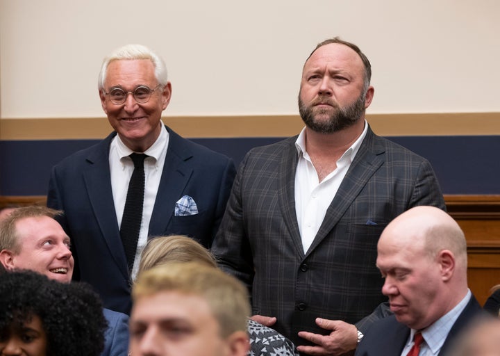 Roger Stone, a confidant of President Trump, left, and radio show host and conspiracy theorist Alex Jones, right, enter the House Judiciary Committee hearing room.