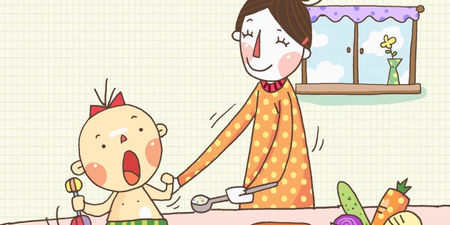 A mother feeding a baby food