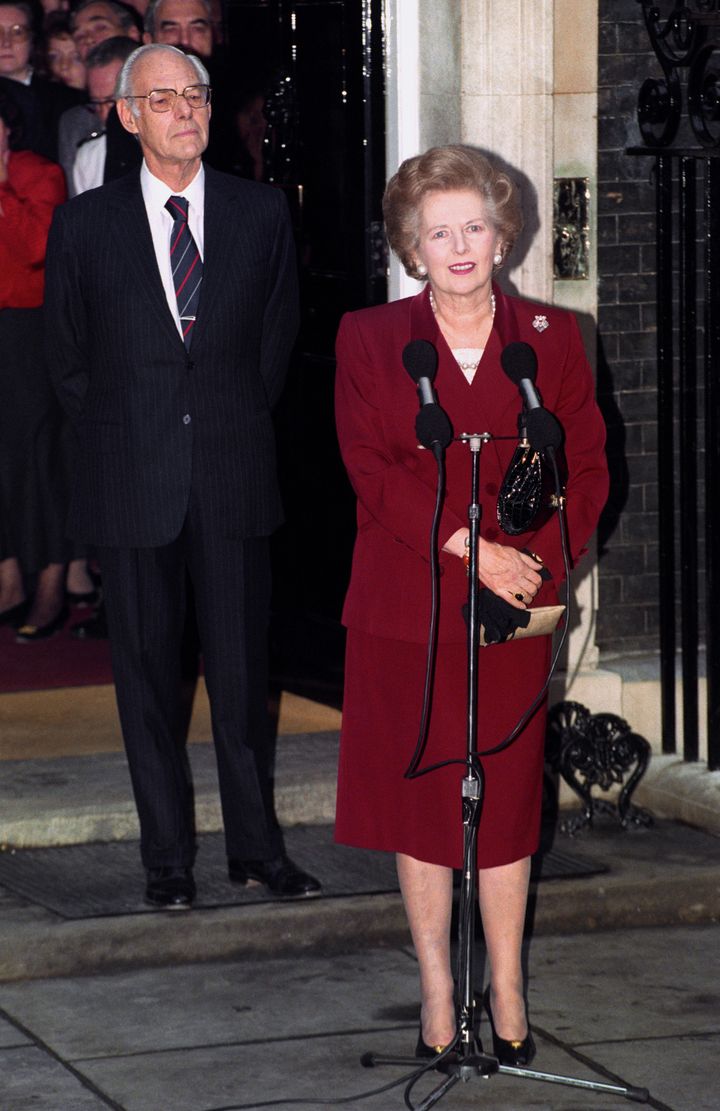 Margaret Thatcher, watched by husband Denis, makes her final speech outside 10 Downing Street.