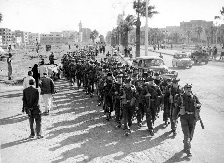 Soldiers of the 1st Battalion the Royal Scots march into Port Said, Egypt, on 16 November, 1956, after landing as replacement troops.