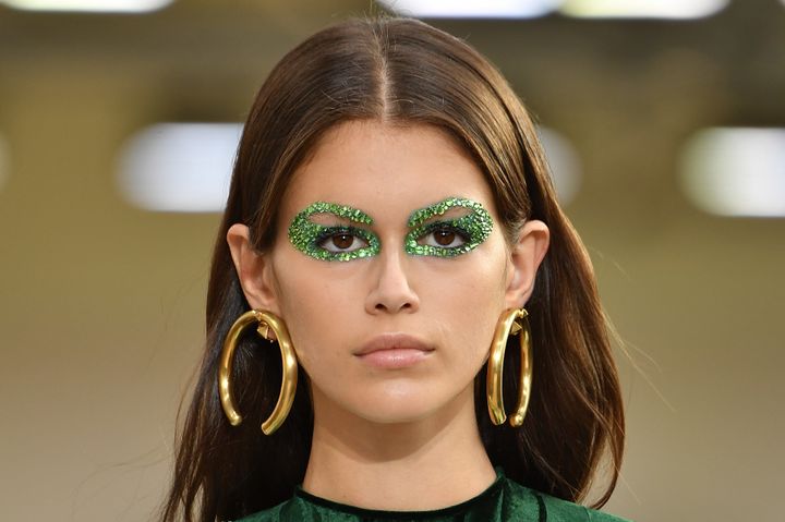 Kaia Gerber walking the runway with some very glittery eye makeup at the Valentino spring 2019 show in Paris. 