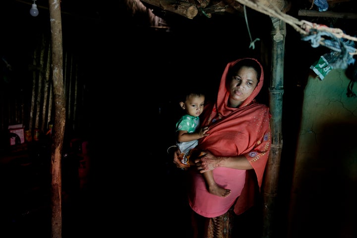 A Rohingya refugee who fled Myanmar. She has convinced her husband to let their eldest daughter study.