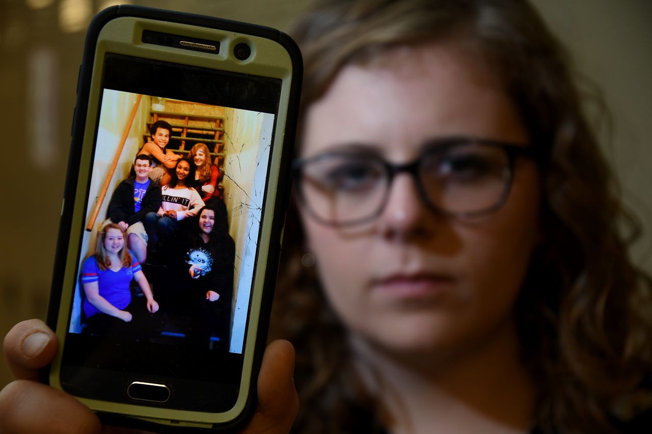Price shows her phone screensaver, which features a photo of her and some friends, including Hoston.
