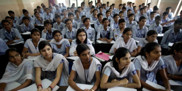 In this Thursday, Aug. 5, 2010 photograph, students attend a class at a cram school in Kota, India. Every year, more than 450,000 students take the Indian Institutes of Technology (IIT) exam, hoping for entry to the hallowed public engineering institutes located across India. Slightly more than 13,000 passed in 2010, a 3 percent success rate. (AP Photo/Saurabh Das)