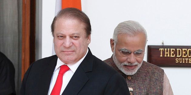 Pakistan's Prime Minister Nawaz Sharif (L) arrives for his bilateral meeting with his Indian counterpart Narendra Modi in New Delhi May 27, 2014. Modi was sworn in as India's prime minister in an elaborate ceremony at New Delhi's resplendent presidential palace on Monday, after a sweeping election victory that ended two terms of rule by the Nehru-Gandhi dynasty. REUTERS/Adnan Abidi (INDIA - Tags: POLITICS)