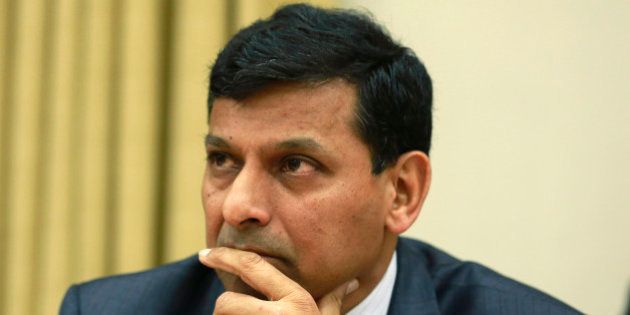 Reserve Bank of India (RBI) Governor Raghuram Rajan listens to a question from a journalist during a news conference at the RBI headquarters in Mumbai, India, Wednesday, Dec. 18, 2013. India's central bank surprised many Wednesday by keeping its key interest rate unchanged despite the worrying rise in inflation. (AP Photo/Rafiq Maqbool)