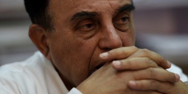 In this photograph taken on May 9, 2016, Subramanian Swamy, an Indian politician and a member of the Rajya Sabha, the upper house of the Indian parliament, gestures during an interview with AFP in New Delhi.He's been called India's Donald Trump: a media-savvy right-wing populist who is unafraid of upsetting everyone from the ruling elite to religious minorities as he rails against corruption. And after returning to parliament following a 15-year absence, Subramanian Swamy says he won't temper his shoot-from-the-hip style that has made him one of India's most popular if divisive politicians. / AFP / MONEY SHARMA / TO GO WITH AFP STORY BY BHUVVAN BHAGGA (Photo credit should read MONEY SHARMA/AFP/Getty Images)
