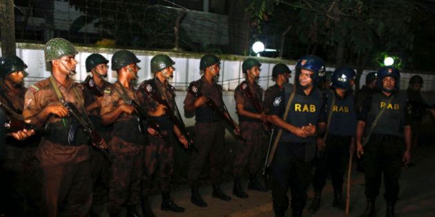 Bangladeshi security personnel cordon off the area after a group of gunmen attacked a restaurant popular with foreigners in a diplomatic zone of the Bangladeshi capital Dhaka, Bangladesh, Friday, July 1, 2016. A group of gunmen attacked the Holey Artisan Bakery in Dhaka's Gulshan area, taking hostages and exchanging gunfire with security forces, according to a restaurant staff member and local media reports. (AP Photo)