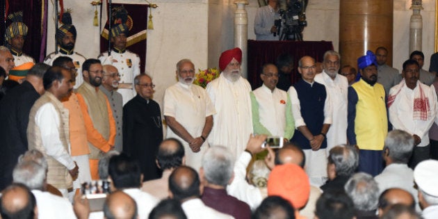 NEW DELHI, INDIA - JULY 5: President Pranab Mukherjee, Prime Minister Narendra Modi and Vice President Hamid Ansari all the newly inducted ministers during the swearing-in ceremony of new ministers following Prime Minister Narendra Modi's cabinet re-shuffle, at the Rashtrpati Bhawan on July 5, 2016 in New Delhi, India. Indian Prime Minister Narendra Modi revamped his cabinet bringing in 19 new junior ministers to speed up decision-making and delivery on promises made in this year's budget. (Photo by Sonu Mehta/Hindustan Times via Getty Images)