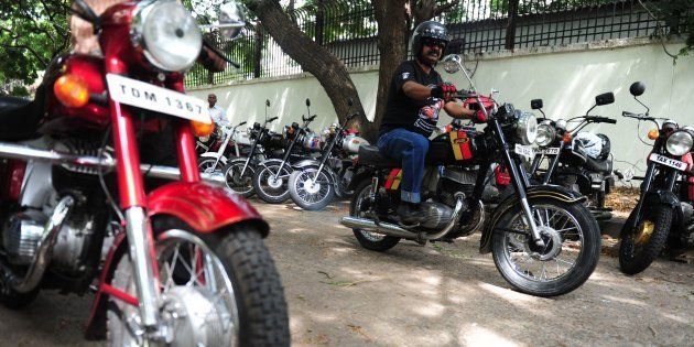 An Indian motorcyclist displays a vintage Yesdi 250 classic motorcycle during a vintage motorcycle exibit in Chennai on July 10, 2016. / AFP / ARUN SANKAR (Photo credit should read ARUN SANKAR/AFP/Getty Images)