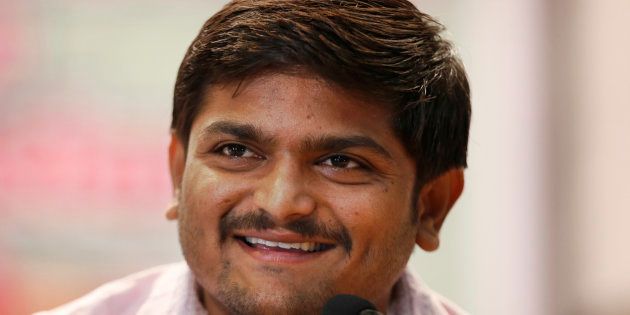 Hardik Patel smiles as he addresses the media after holding a meeting of his newly formed Patel Navnirman Sena (PNS) in New Delhi, India.
