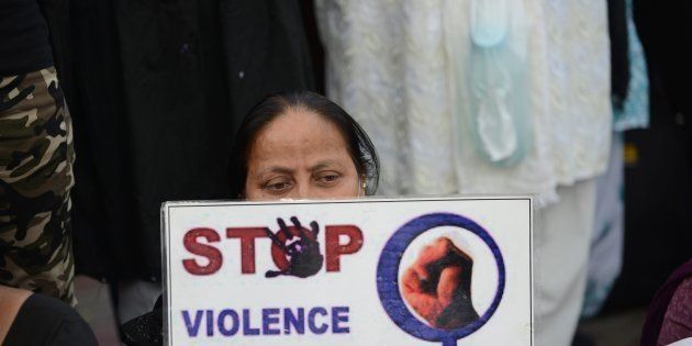 A woman attends a peace protest in Ahmedabad on March 20, 2015, in the wake of the gang-rape on an elderly nun.