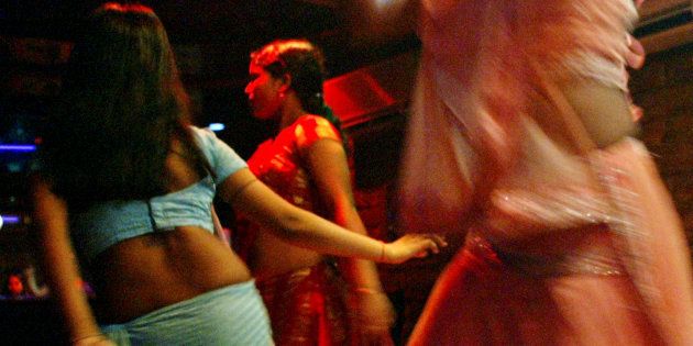 Indian bar girls perform at a dance bar in Bombay May 5, 2005. REUTERS/Punit Paranjpe AD/LD