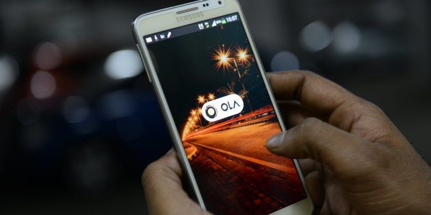 BENGALURU, INDIA - OCTOBER 1: OLA cabs booking using mobile app on October 1, 2015 in Bengaluru, India. (Photo by Hemant Mishra/Mint via Getty Images)