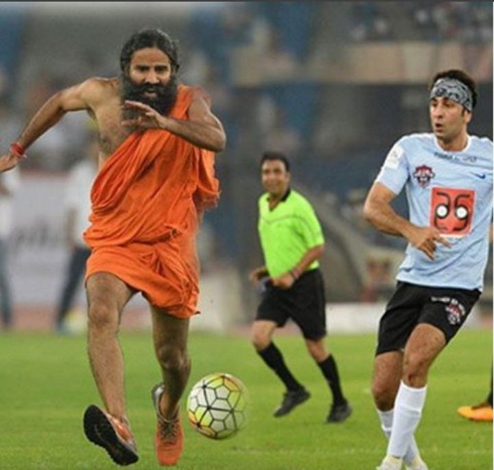 Baba Ramdev plays football with Bollywood actor Ranbir Kapoor.