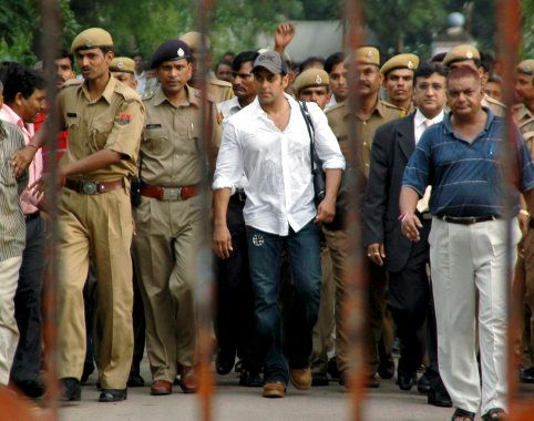 Bollywood actor Salman Khan is surrounded by police personnel as he walks out of a jail in Jodhpur. Reuters