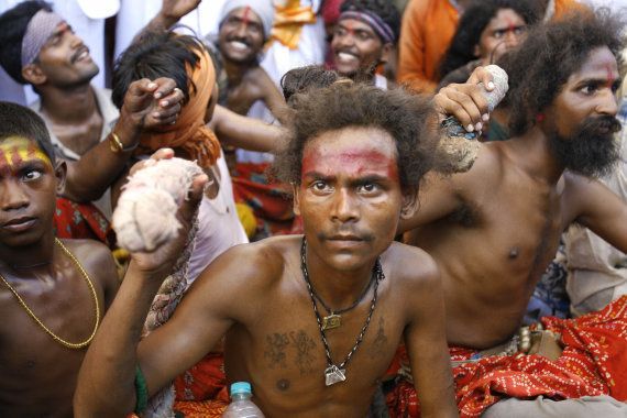 Dalits sit during a mass conversion to Buddhism ceremony in Mumbai, 27 May 2007. AFP PHOTO/ Sajjad HUSSAIN