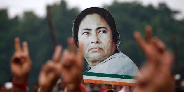Supporters hold a cut-out of chief minister Mamata Banerjee during a rally in Kolkata in 2011.