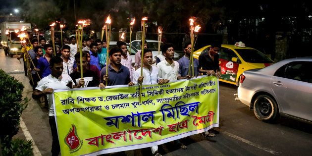Bangladesh Student Union arranged a torch procession to protest against the killing of bloggers, writers, teachers and editors in Dhaka on 26 April 2016. (Photo by Mohammad Ponir Hossain/NurPhoto via Getty Images)
