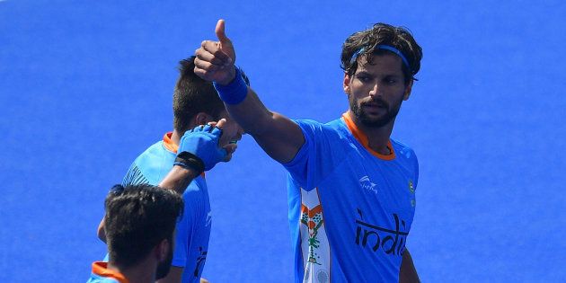 India's Rupinder Pal Singh (R) celebrates scoring a goal during the men's field hockey India vs Ireland match of the Rio 2016 Olympics.