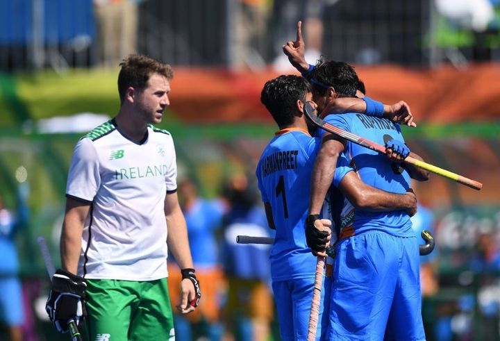 India's Rupinder Pal Singh (R) celebrates scoring a goal with teammates during the men's field hockey India vs Ireland match of the Rio 2016 Olympics.