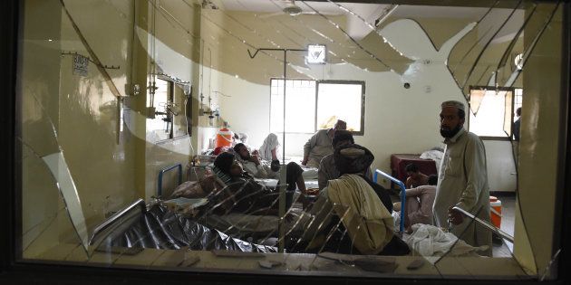 Pakistani victims injured in a suicide bombing are treated at a hospital in Quetta on 8 Aug.