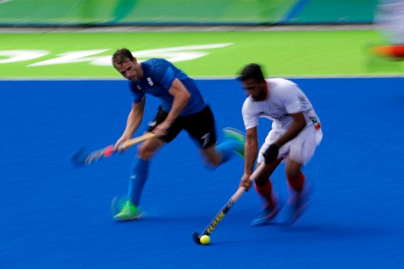 India's Surender Kumar, right, fights for the ball with Argentina's Facundo Callioni during a men's field hockey match at the 2016 Summer Olympics in Rio de Janeiro.