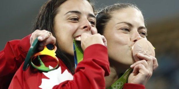 The real reason why Olympians chomp down on their medals