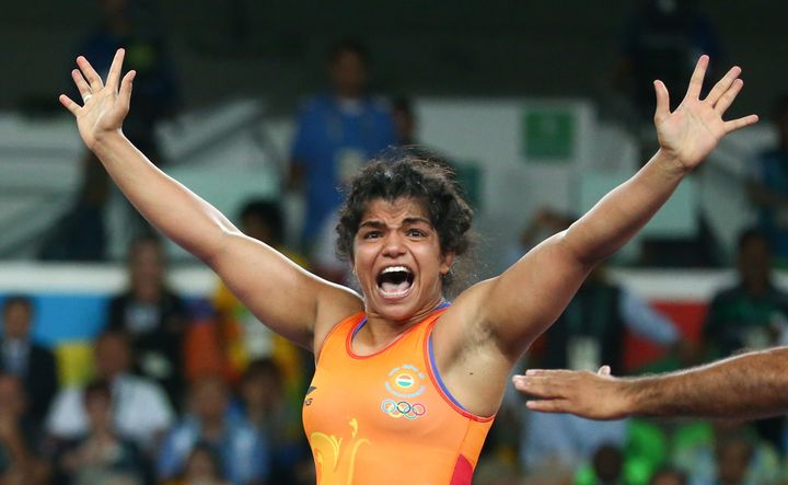 Sakshi Malik (IND) of India celebrates winning the bronze medal after her victory against Aisuluu Tynybekova (KGZ) of Kyrgyzstan