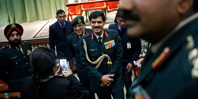 File photo of Indian Army chief General Dalbir Singh (C) leaves the venue after addressing a news conference in New Delhi on 13 January, 2015.
