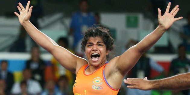 Sakshi Malik (IND) of India celebrates winning the bronze medal at the Rio Olympics after her victory against Aisuluu Tynybekova (KGZ) of Kyrgyzstan on 17 August, 2016.