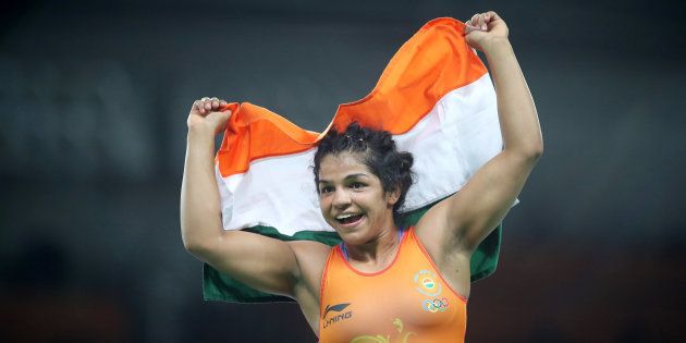 Sakshi Malik of India celebrates victory against Aisuluu Tynybekova of Kyrgyzstan during their Women's Freestyle 58 kg Bronze Medal Final at the Rio Games on 17 August, 2016.