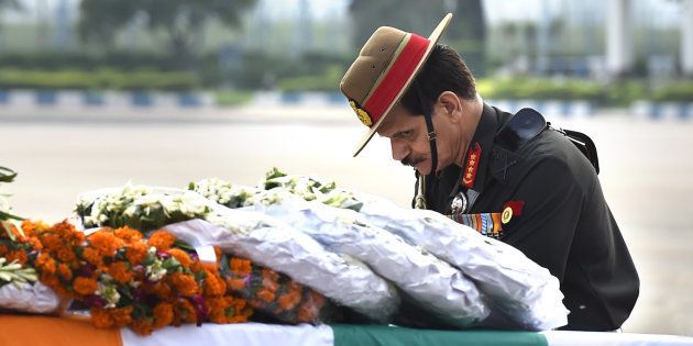 Army Chief Dalbir Singh paying tributes to two Army jawans killed in an encounter with militants in in Jammu and Kashmir in July.