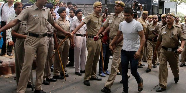 Vinay Sharma (wearing white T-shirt), one of the four men who were sentenced to death for fatally raping a young woman on a bus last December.