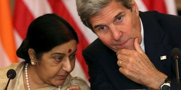 US Secretary of State John Kerry (R) chats with External Affairs Minister Sushma Swaraj (L). REUTERS/Gary Cameron