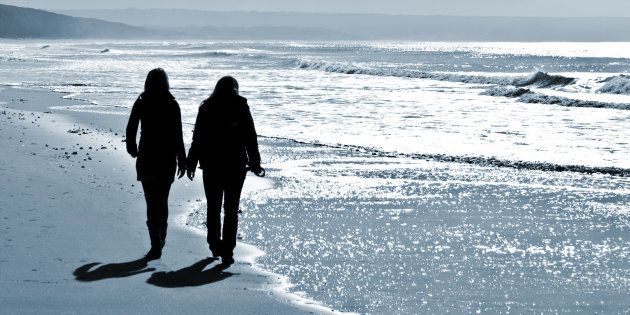 women walking at the beach