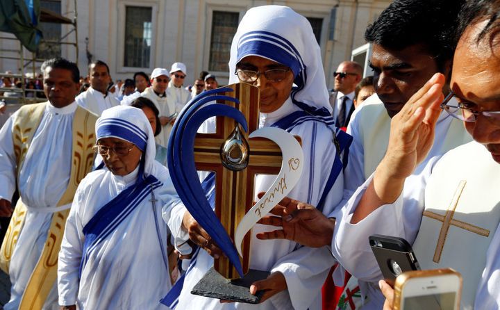 A nun, belonging to the global Missionaries of Charity, carries a relic of Mother Teresa.