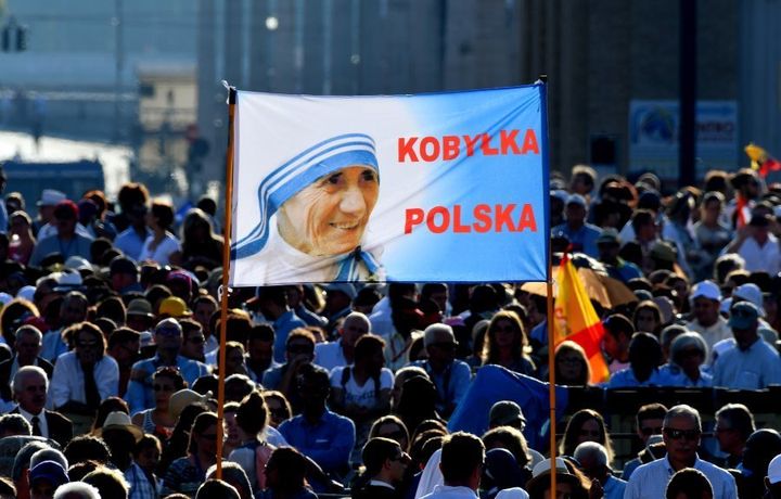 Polish faithful hold a banner reading the name of their city as they arrive to attend the Canonisation of Mother Teresa.