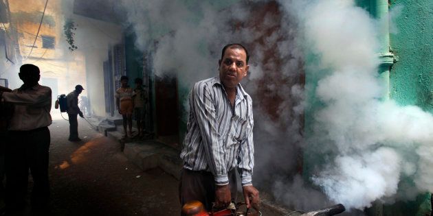 File photo of a Municipal Corporation of Delhi worker fumigating a residential area.